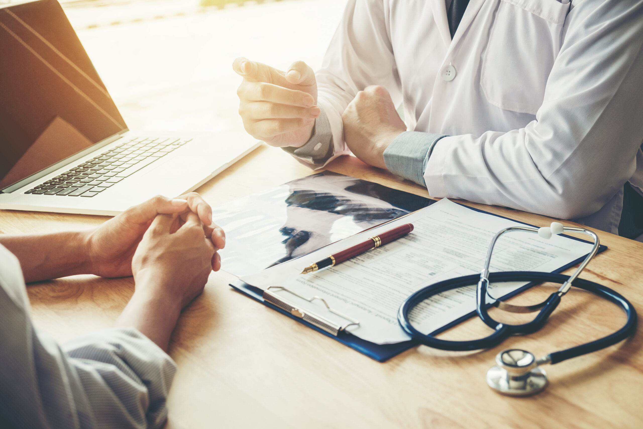 Doctor consulting with patient